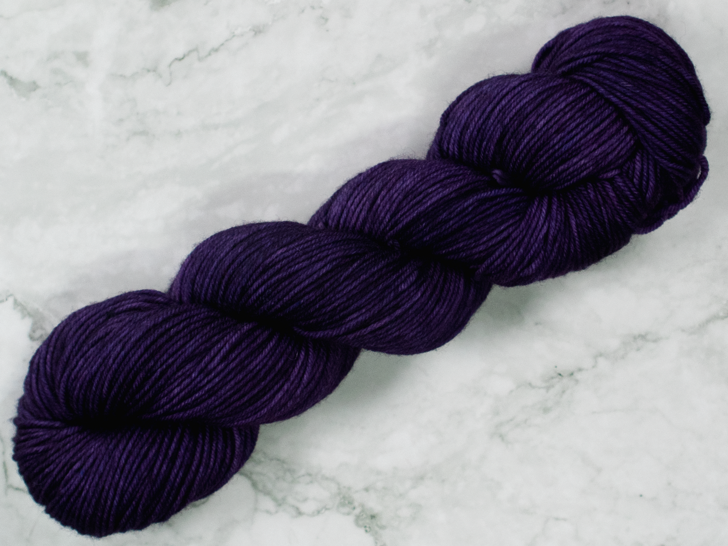Photo of DK Weight yarn in "Nurple"