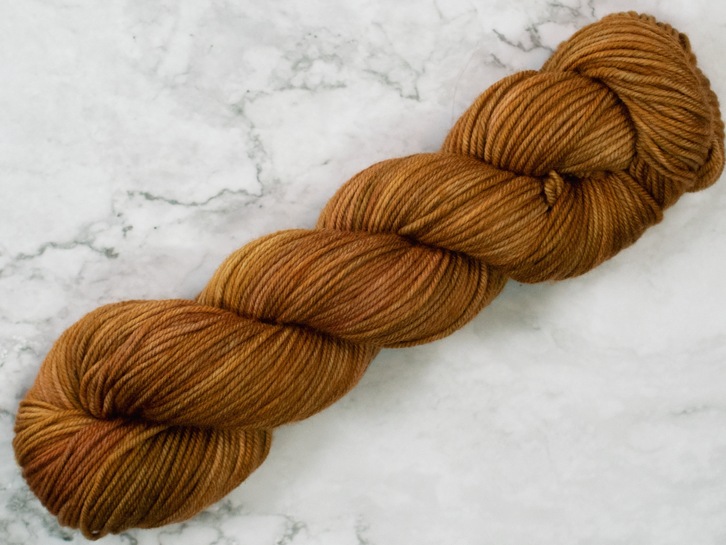 Photo of DK Weight yarn in "Brass Monkey"