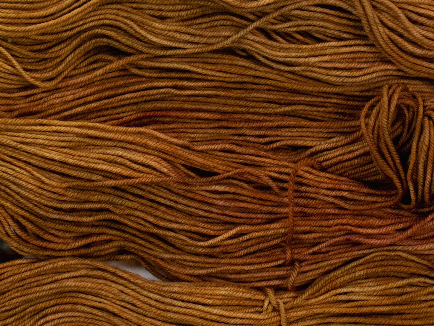 Photo of DK Weight yarn in "Brass Monkey"