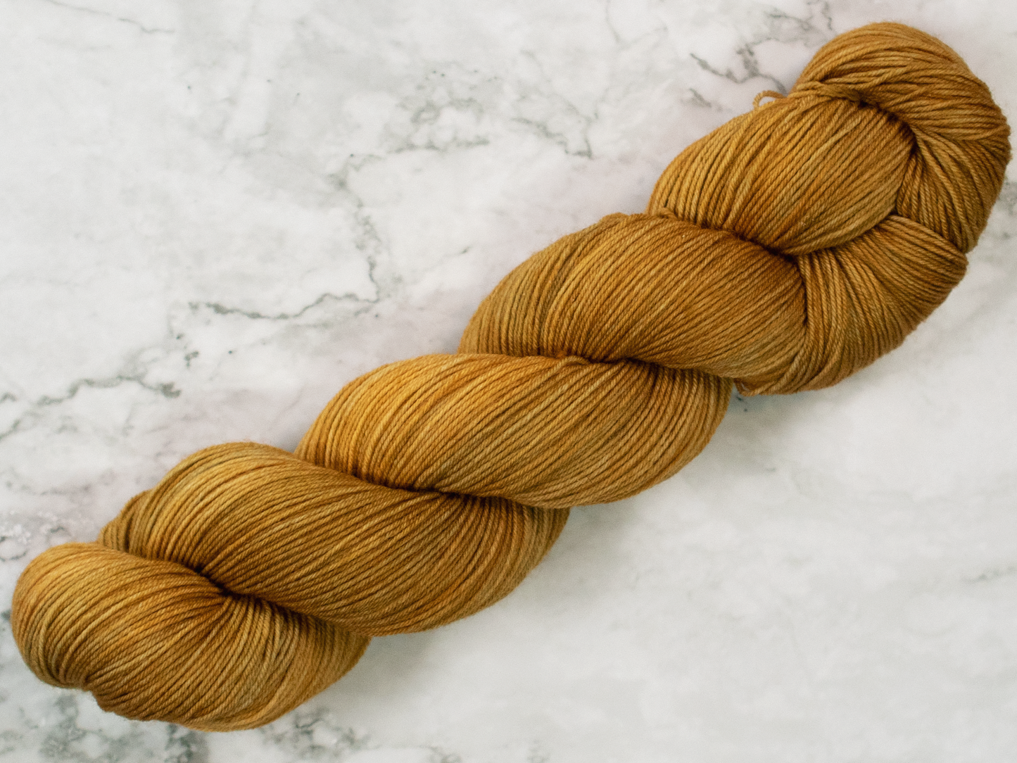 Photo of Fingering Weight yarn in "Brass Monkey"